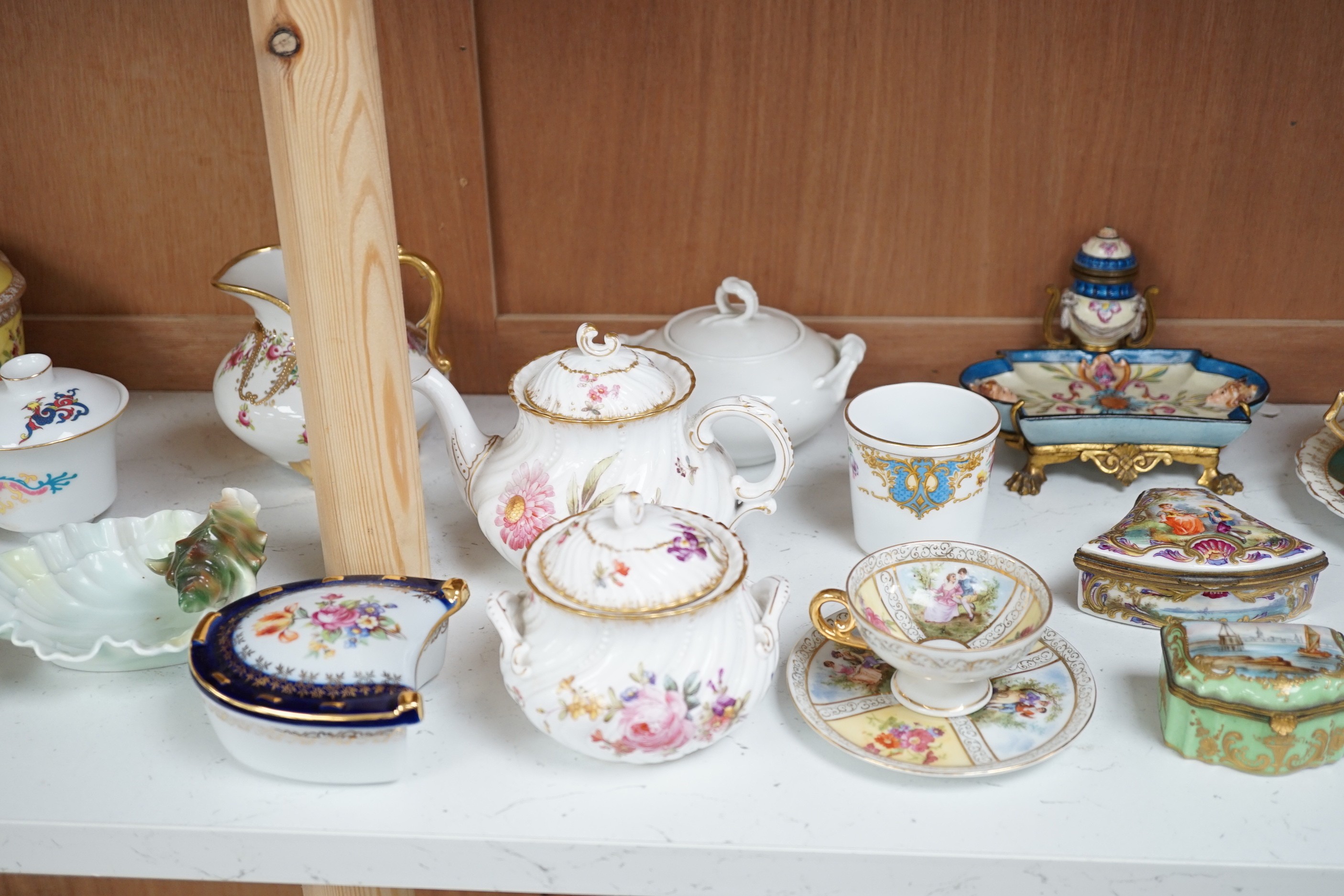 A large group of continental ceramics to include mainly 19th century including one piece of Zsolnay, Dresden wares, trinket boxes, a pottery and gilt metal mounted inkstand etc